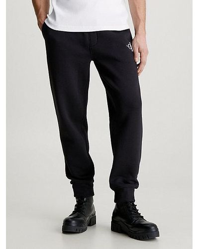 Calvin Klein Pantalón de chándal de felpa con monograma - Negro