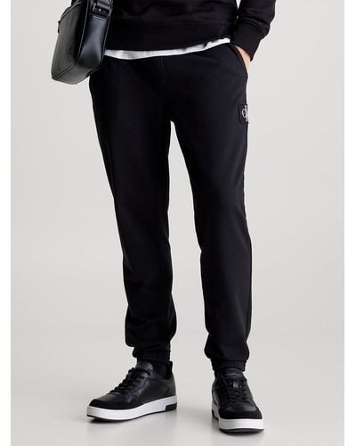 Calvin Klein Pantalon de jogging skinny en tissu éponge avec insigne - Noir