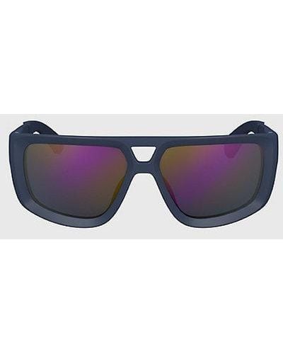 Calvin Klein Modifizierte rechteckige Sonnenbrille CKJ24605S - Lila
