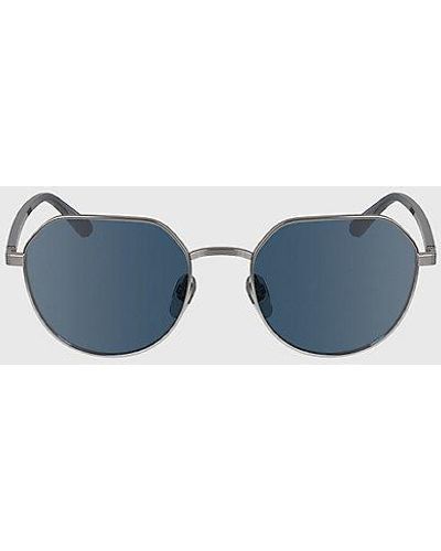Calvin Klein Runde Sonnenbrille CK23125S - Blau