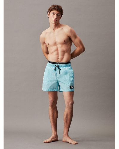 Calvin Klein Short de bain court avec double ceinture - CK Monogram - Bleu