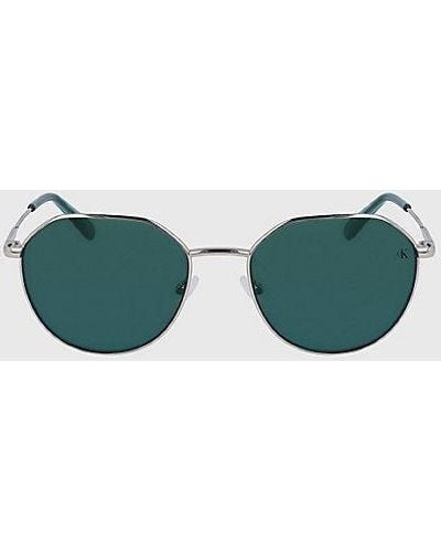 Calvin Klein Runde Sonnenbrille CK23201S - Grün