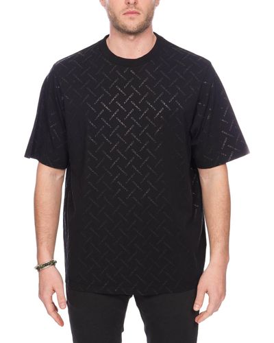 Marcelo Burlon T-shirt nera in cotone con monogramma logo - Nero