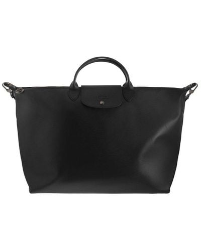 Black Longchamp Luggage and suitcases for Women | Lyst