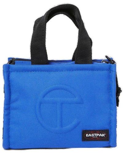 Eastpak X Telfar Logo Embossed Top Handle Bag - Blue