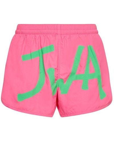JW Anderson Logo Printed Curved Hem Swim Shorts - Pink