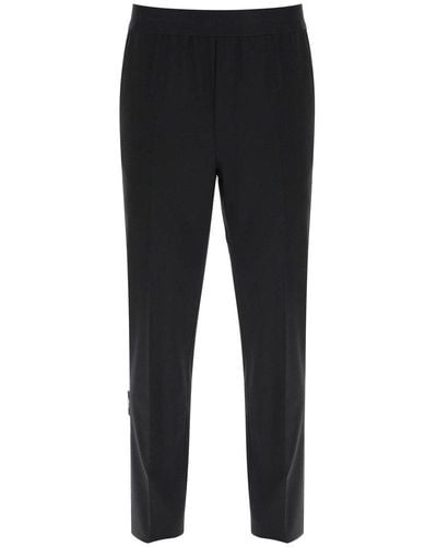 MSGM Logo-waistband Tapered-leg Stretched Trousers - Black