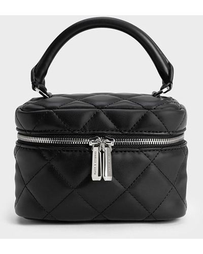 Women's Charles & Keith Makeup bags and cosmetic cases from $49