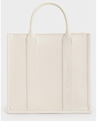 Trapeze-shaped bag with wide shoulder strap :: LICHI - Online