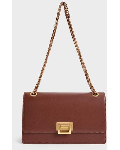CHARLES & KEITH - Products featured: Madison Caged See-Through Slide  Sandals -  Sonnet Two-Tone Chain Handle  Shoulder Bag -  Shalia Canvas  Chain-Handle Moon Bag 