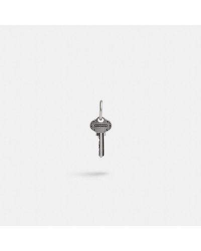 COACH Sterling Silver Key Single Huggie Earring - White