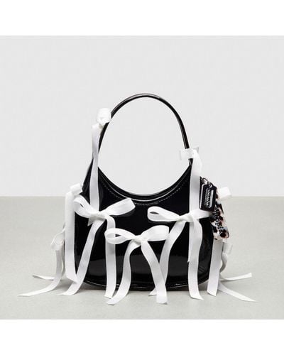 COACH Ergo Bag In Crinkle Patent Topia Leather With Bows All Over - Black