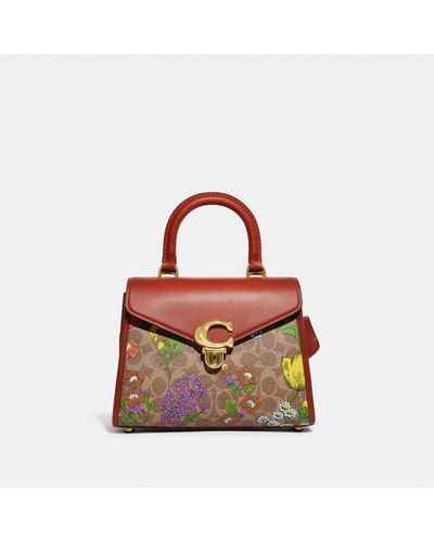 COACH Sammy Top Handle In Signature Canvas With Floral Print - Pink