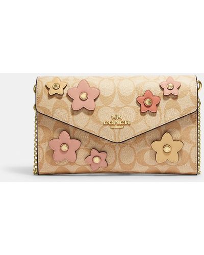 COACH Envelope Clutch Crossbody In Signature Canvas With Floral Applique - Natural