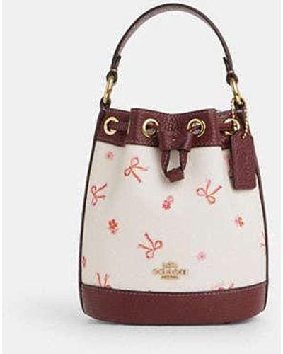 COACH Dempsey Drawstring Bucket Bag 15 With Bow Print - Pink
