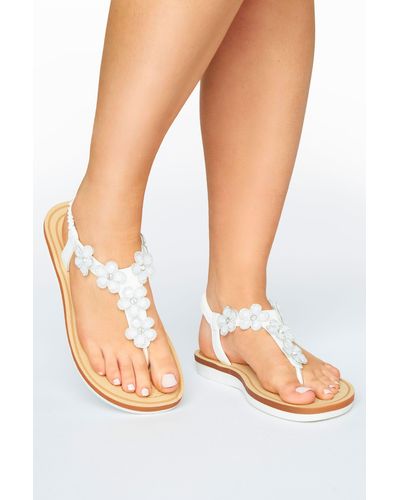 https://cdna.lystit.com/400/500/tr/photos/debenhams/8520bf06/yours-designer-White-Extra-Wide-Fit-Diamante-Flower-Sandals.jpeg