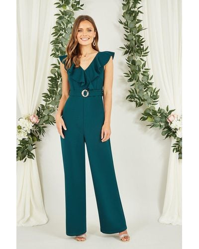 Mela Green Jumpsuit With Gold Buckle And Frill Detail