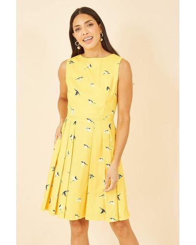 Mela Yellow Swallow Print Skater Dress