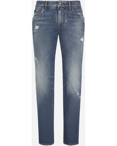 Dolce & Gabbana Jeans slim stretch blu chiaro con abrasioni