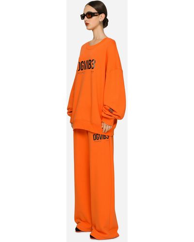 Dolce & Gabbana Pantaloni jogging in jersey con stampa DG VIB3 - Arancione