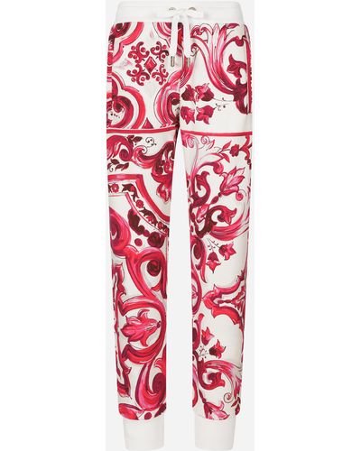 Dolce & Gabbana Pantalon de jogging en jersey à imprimé majoliques - Rouge