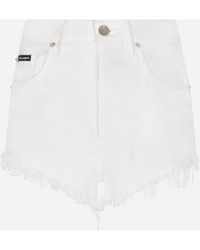 Dolce & Gabbana Shorts in denim con rotture e abrasioni - Bianco