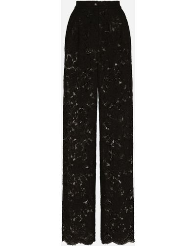 Dolce & Gabbana Pantalon flare en dentelle stretch à logo - Noir