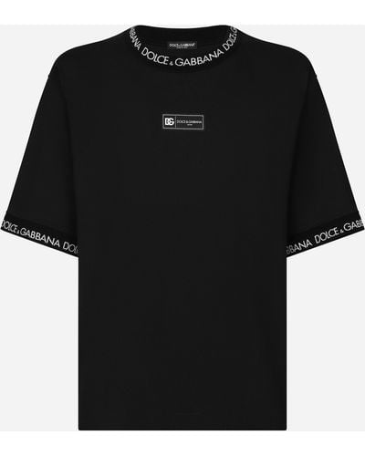 Dolce & Gabbana Kurzarm-T-Shirt aus Baumwolle Allover-Logo - Schwarz