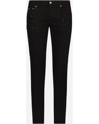 Dolce & Gabbana Jeans skinny stretch con ricami di strass - Nero