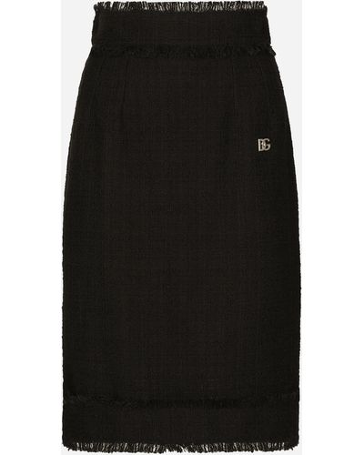 Dolce & Gabbana Falda midi de tweed con logotipo DG - Negro