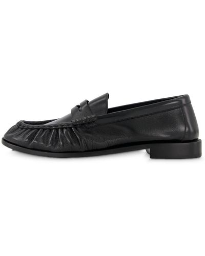 Saint Laurent Schuhe LE LOAFER aus glänzendem Leder in Knitteroptik - Schwarz