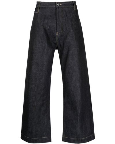 Studio Nicholson Pantalon en jean à coupe ample - Bleu