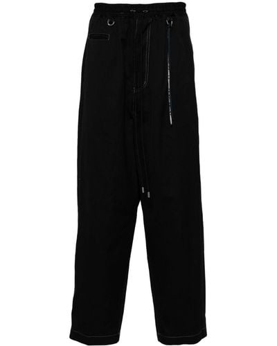 Mastermind Japan Pantalones con calavera estampada - Negro