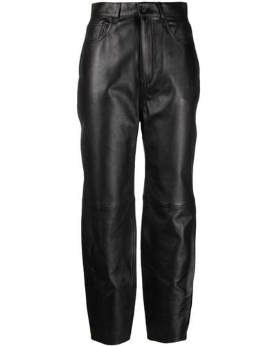 Totême Tapered-leg leather trousers - Nero