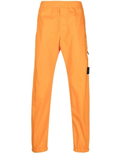 Stone Island Pantalones de chándal con parche Compass - Naranja