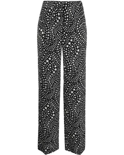 Stella McCartney Pantalones con estrellas estampadas - Negro