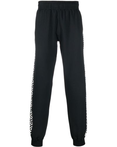 Versace Jogginghose mit Greca-Streifen - Schwarz