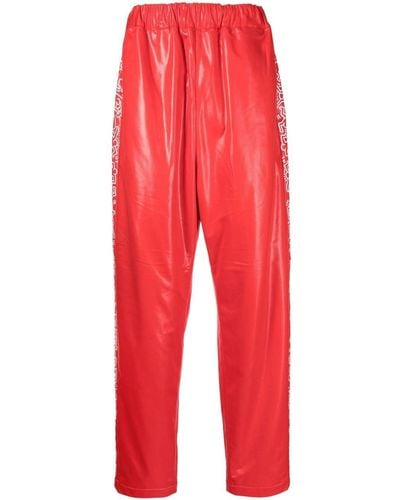 Junya Watanabe Pantalones de chándal con estampado gráfico - Rojo