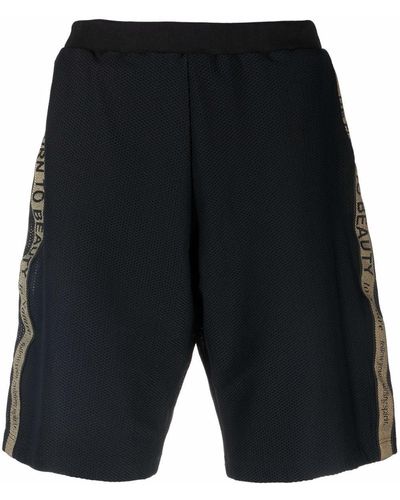 Etro Pantalones cortos con franjas del logo - Negro