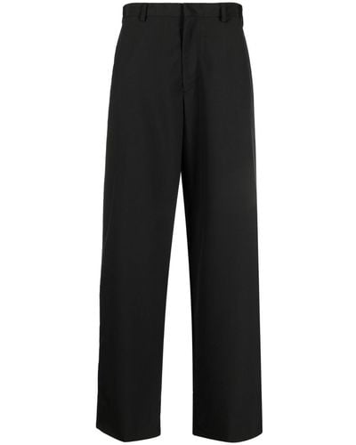 Prada Pantalones anchos con parche del logo - Negro