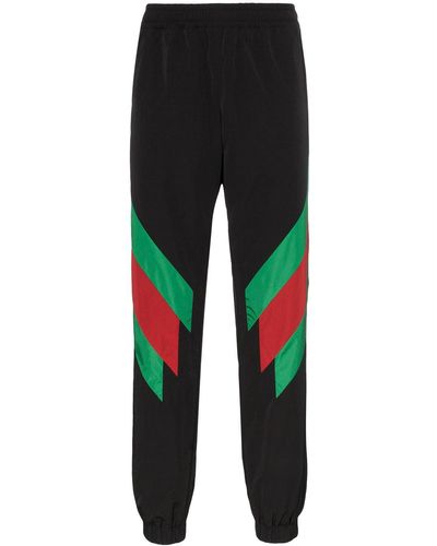 Gucci Pantaloni tuta in nylon con intarsio Web - Nero