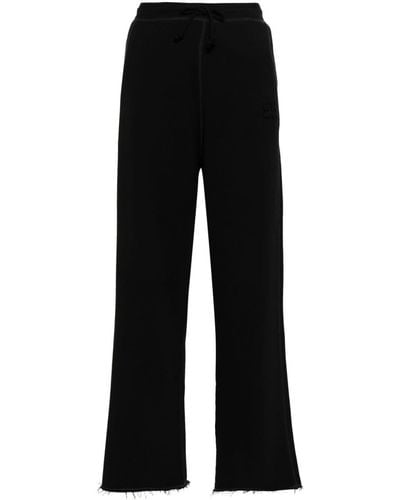 Ganni Pantalones de chándal con logo bordado - Negro