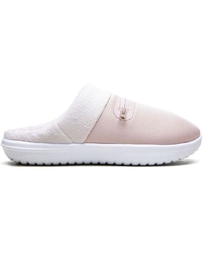 all white nike slippers