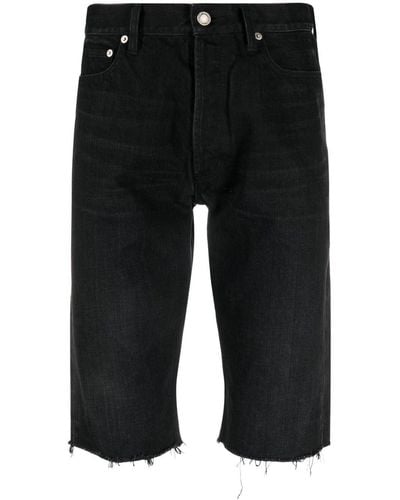 Saint Laurent Pantalones vaqueros cortos con bordes deshilachados - Negro