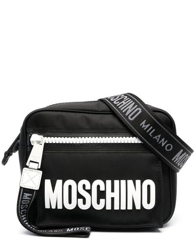 Moschino Sac porté épaule à logo imprimé - Noir