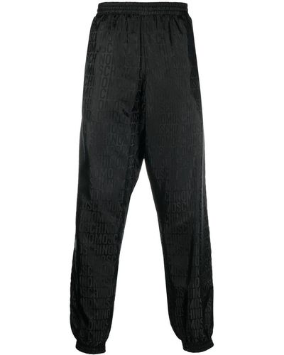 Moschino Pantalones de chándal con monograma en jacquard - Negro