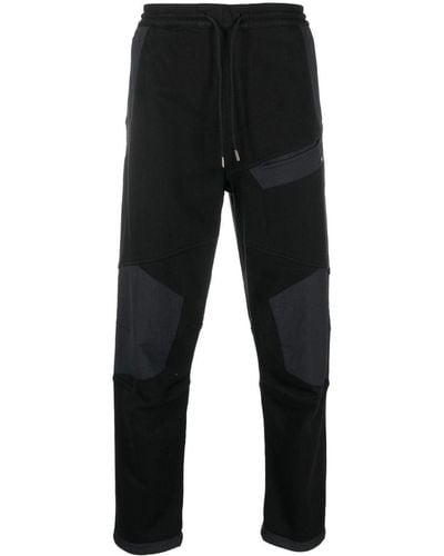 Maharishi Pantalon de jogging Maha Tech à design à empiècements - Noir
