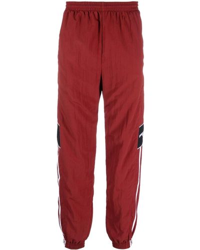 Martine Rose Pantalones de chándal con paneles - Rojo