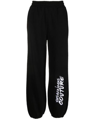 Versace Pantalon de jogging à logo imprimé - Noir
