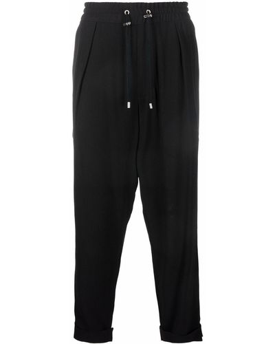 Balmain Pantalon de jogging fuselé en crêpe - Noir